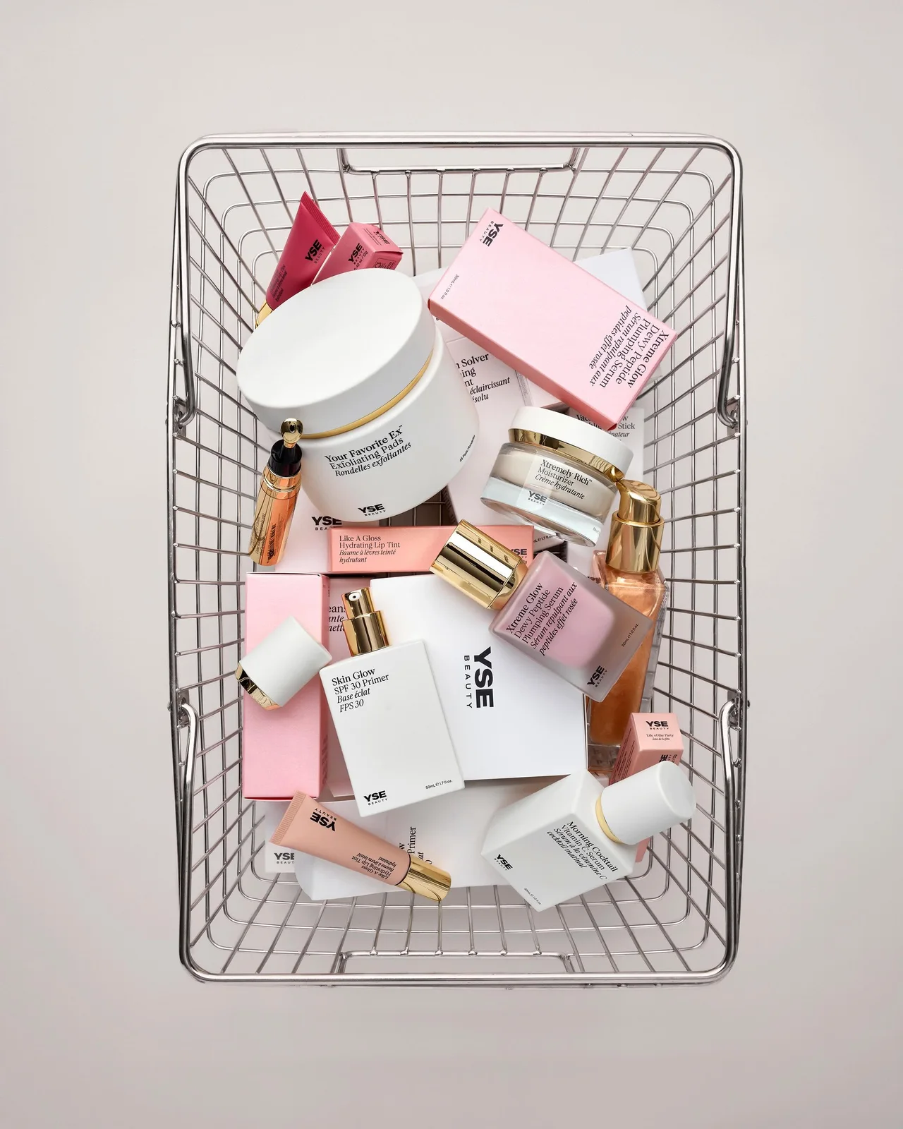 YSE Beauty skincare products piled in a wire shopping basket